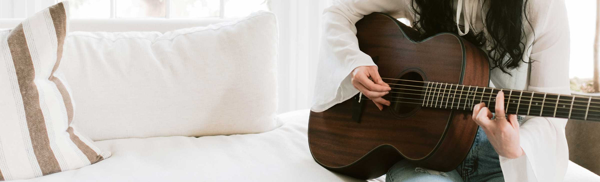 Oliver mahogany guitar on a rug
